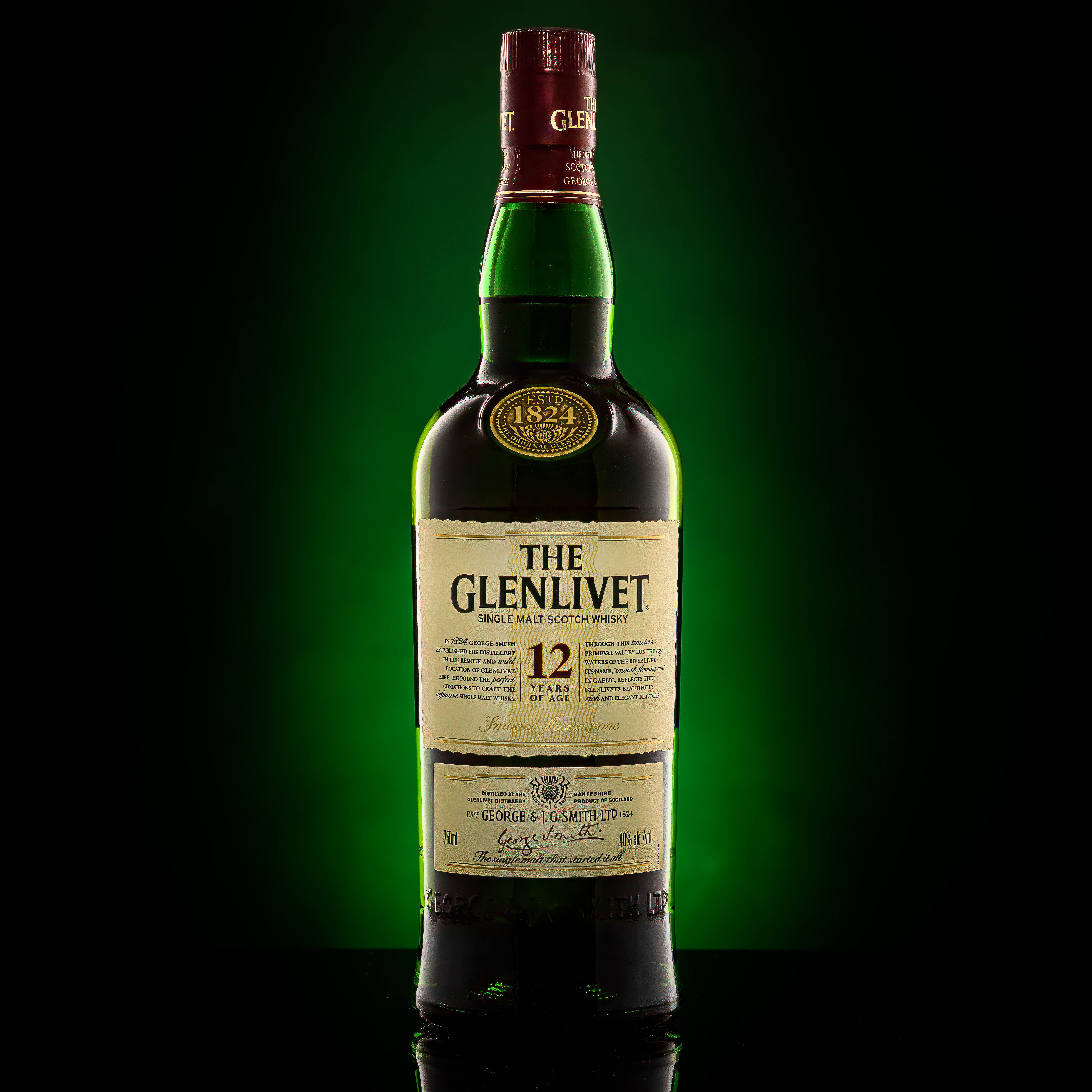 Bottle of scotch on non-white background - shot in studio Image