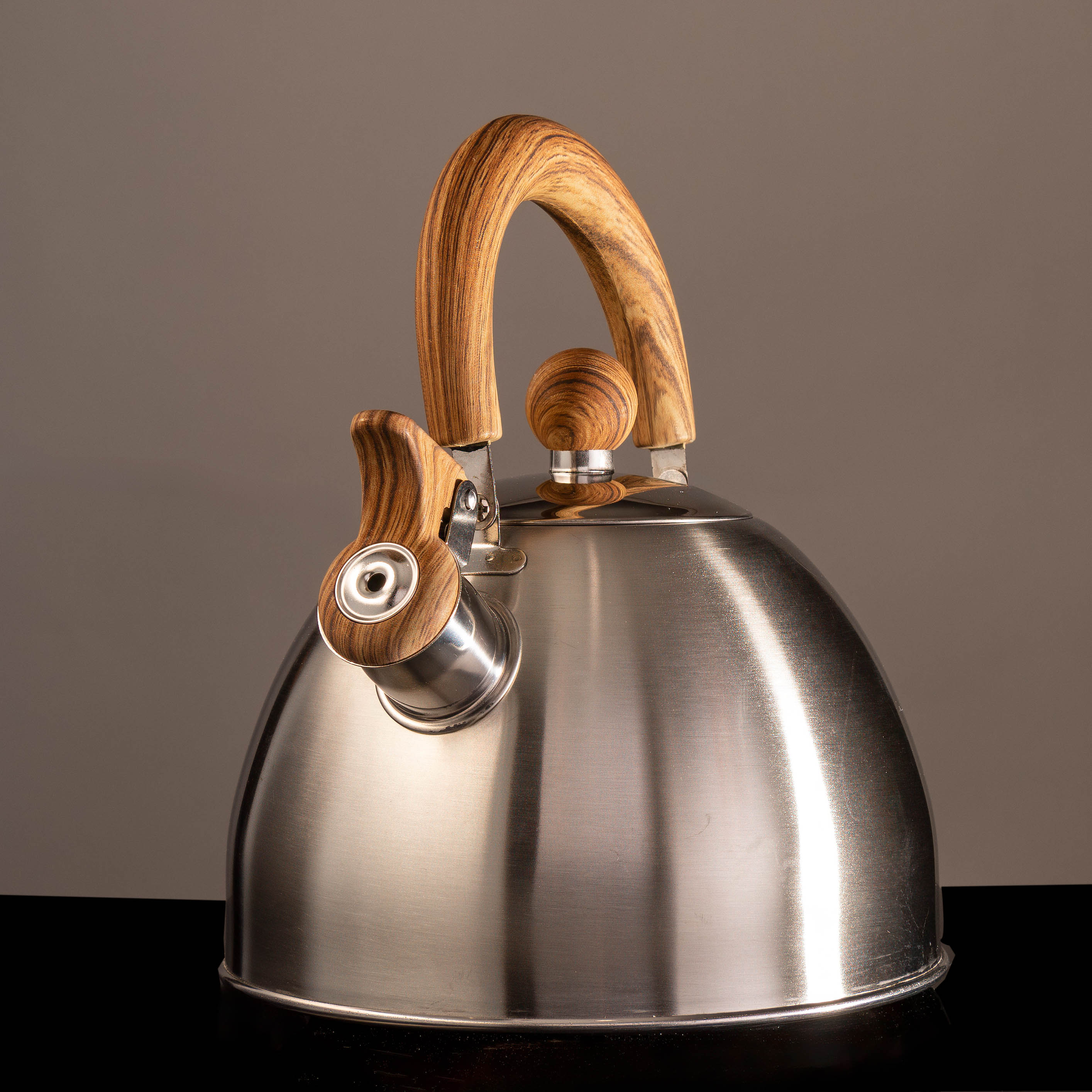 Tea kettle on non-white background - shot in studio tea kettle on gray and black background shot in studio