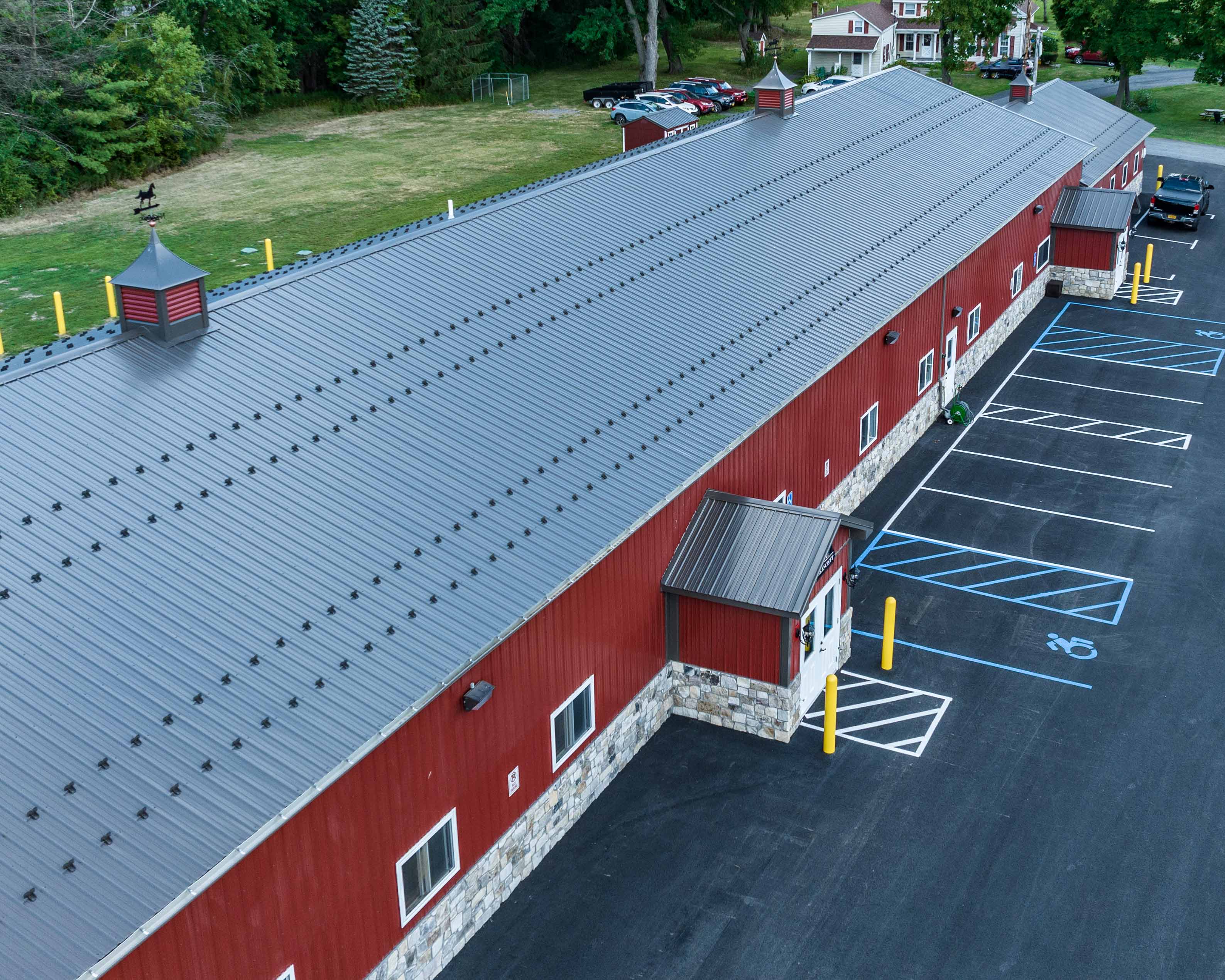 Metal Building / Roof Construction: Marketing Image for Metal Roof Supplier Metal Roof Installation - aerial view on location Selkirk NY - rcm Imaging