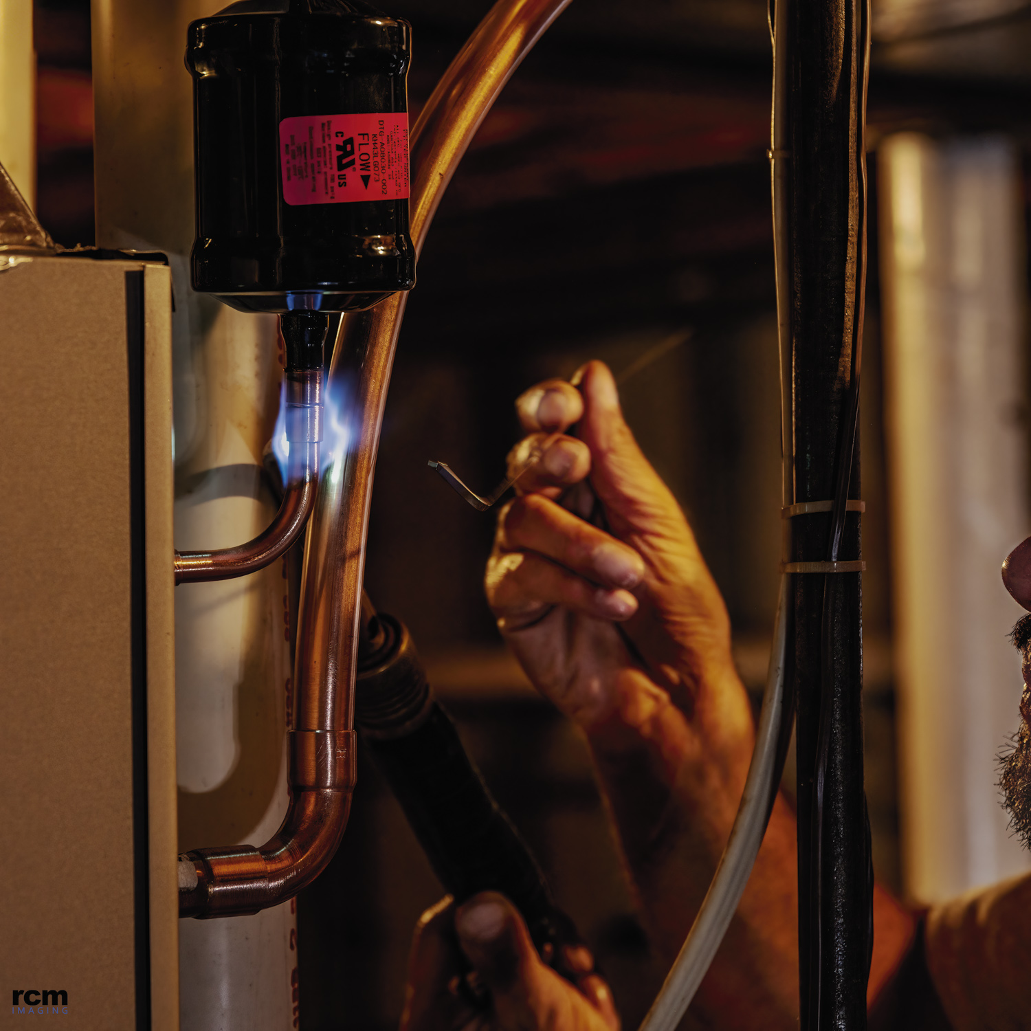 Bourque HVAC Technician Soldering During New Furnace/Air Conditioner Installation HVAC Technician