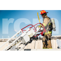 Firefighter leaving top of building via aerial laddder