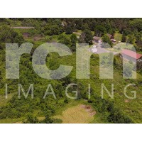 Rural electrical distribution lines - wooded area with buildings