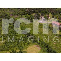 Rural electrical distribution lines - wooded area with buildings